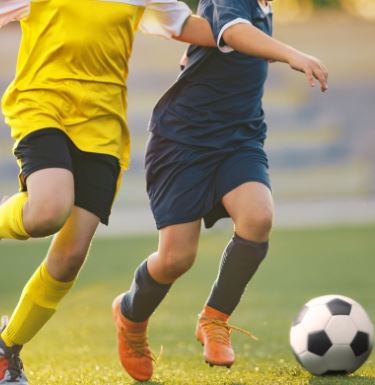 New Image Kids playing soccer
