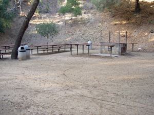 Hans Christian Andersen Park Area B with picnic tables and trash receptacles. 